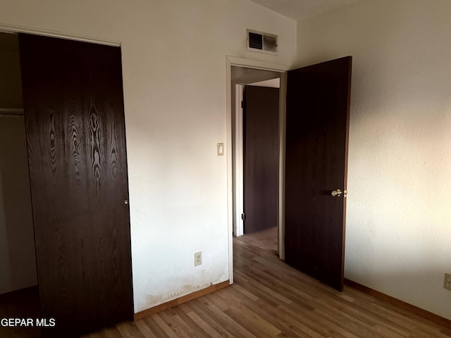 9212 Atun Way, El Paso, TX 79907 - unfurnished bedroom with wood finished floors and a closet