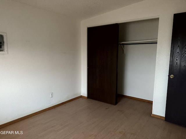 9212 Atun Way, El Paso, TX 79907 - unfurnished bedroom featuring wood finished floors and a closet