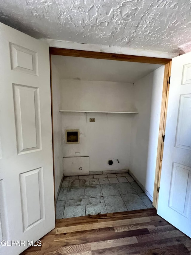 9212 Atun Way, El Paso, TX 79907 - laundry area with wood finished floors and washer hookup