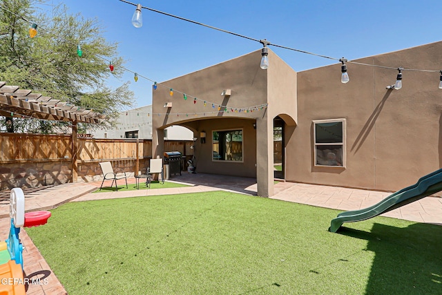13474 Lawkland St, El Paso, TX 79928 - back of house featuring stucco siding and a patio area