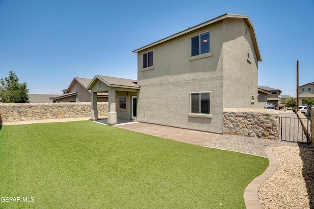 7548 Wolf Creek Dr, El Paso, TX 79911 - back of house featuring stucco siding and a patio