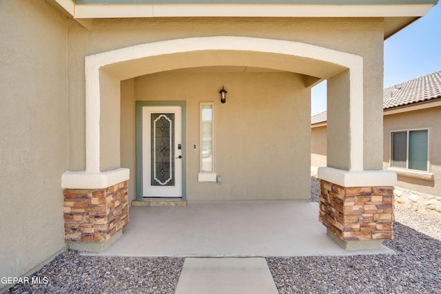7548 Wolf Creek Dr, El Paso, TX 79911 - entrance to property featuring stucco siding and stone siding