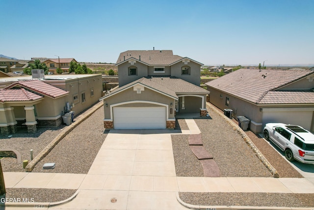 7548 Wolf Creek Dr, El Paso, TX 79911 - mediterranean / spanish home with an attached garage, concrete driveway, stucco siding, a residential view, and stone siding