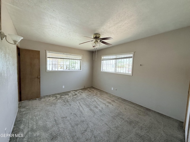 5542 Vancouver St, El Paso, TX 79924 - carpeted spare room featuring ceiling fan and a textured ceiling