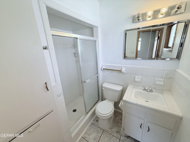 5542 Vancouver St, El Paso, TX 79924 - bathroom with vanity, a stall shower, and a wainscoted wall