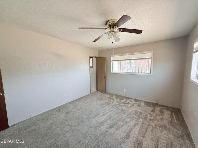 5542 Vancouver St, El Paso, TX 79924 - spare room with healthy amount of natural light, a textured ceiling, carpet flooring, and ceiling fan