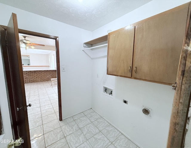 5542 Vancouver St, El Paso, TX 79924 - laundry room featuring cabinet space, electric dryer hookup, hookup for a washing machine, ceiling fan, and a textured ceiling