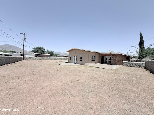 5542 Vancouver St, El Paso, TX 79924 - rear view of house with a patio area and a fenced backyard