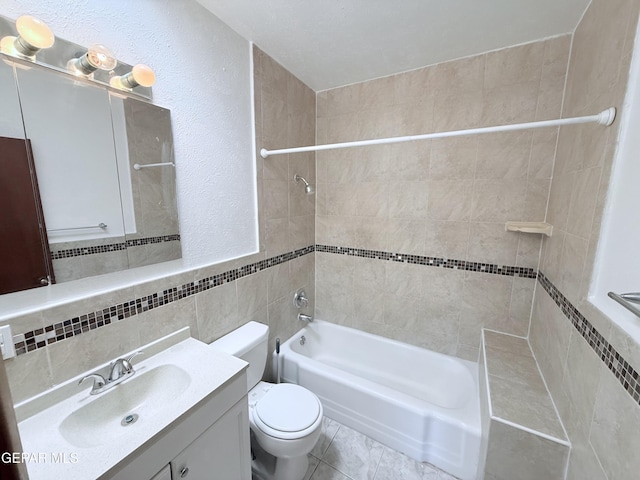 5542 Vancouver St, El Paso, TX 79924 - bathroom with tile walls, vanity, and  shower combination