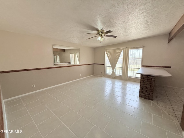 5542 Vancouver St, El Paso, TX 79924 - spare room with a ceiling fan, a textured ceiling, and light tile patterned flooring