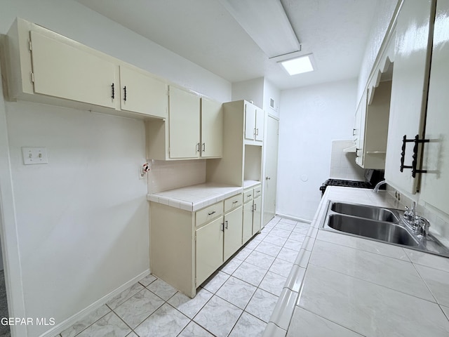 5542 Vancouver St, El Paso, TX 79924 - kitchen featuring range and tile counters