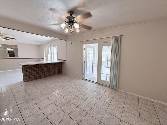 5542 Vancouver St, El Paso, TX 79924 - unfurnished room featuring a ceiling fan, light tile patterned flooring, and a textured ceiling
