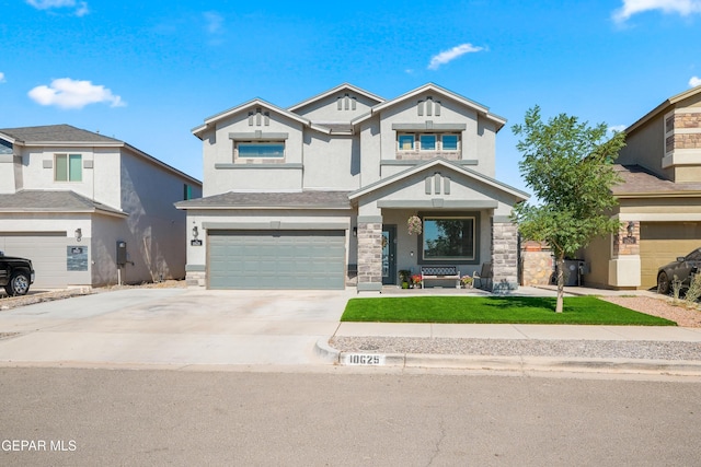 10625 Hidden Links Pl, El Paso, TX 79924 - view of front facade with a garage, stucco siding, stone siding, driveway, and a front yard