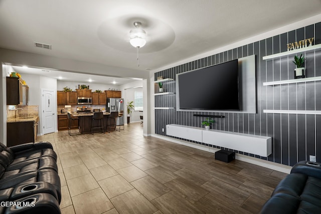 10625 Hidden Links Pl, El Paso, TX 79924 - living area with ceiling fan and baseboards