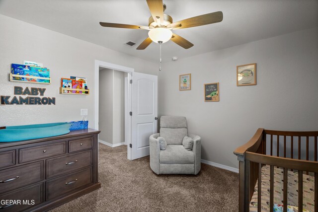 10625 Hidden Links Pl, El Paso, TX 79924 - bedroom with light carpet, a nursery area, and ceiling fan