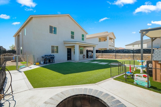 10625 Hidden Links Pl, El Paso, TX 79924 - back of house featuring a gate, a fenced backyard, a patio, a fire pit, and stucco siding