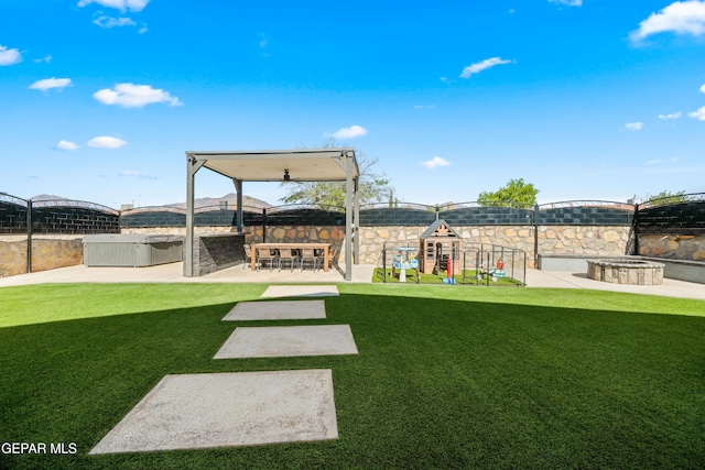 10625 Hidden Links Pl, El Paso, TX 79924 - view of grassy yard featuring a playground, a patio, and an outdoor kitchen