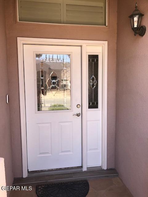 6392 Franklin Gate Dr, El Paso, TX 79912 - property entrance featuring stucco siding