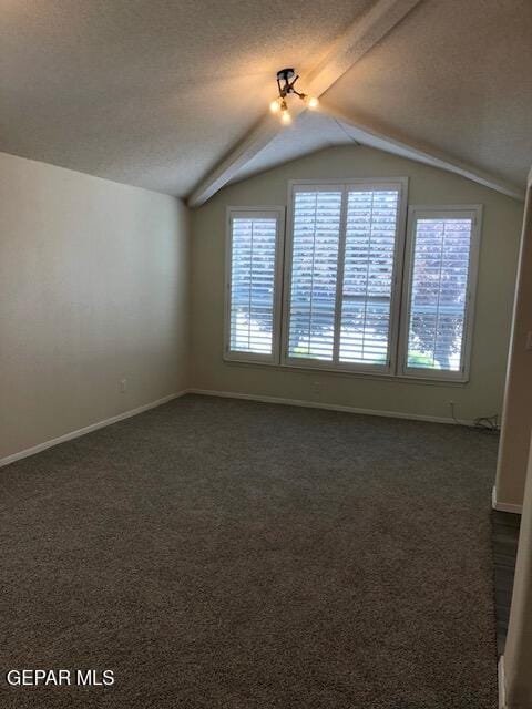 6392 Franklin Gate Dr, El Paso, TX 79912 - additional living space with dark colored carpet, lofted ceiling, and a textured ceiling