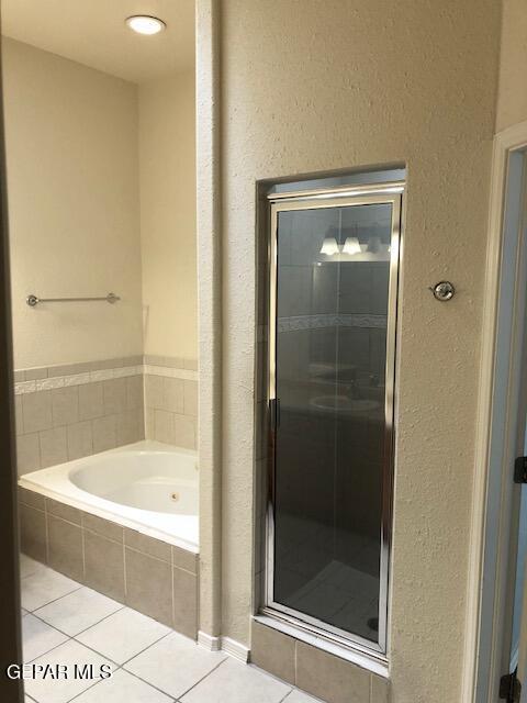 6392 Franklin Gate Dr, El Paso, TX 79912 - full bath with tile patterned floors, a tub with jets, and a shower stall