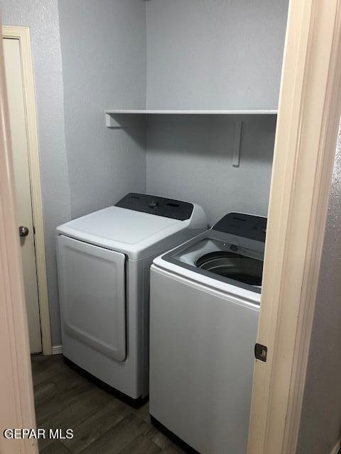 6392 Franklin Gate Dr, El Paso, TX 79912 - laundry area with washing machine and clothes dryer and dark wood-style floors