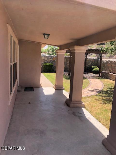 6392 Franklin Gate Dr, El Paso, TX 79912 - fenced backyard featuring a patio area