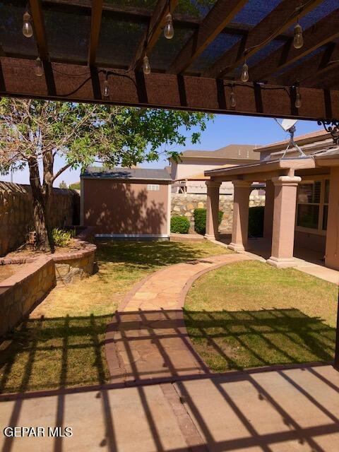 6392 Franklin Gate Dr, El Paso, TX 79912 - view of patio featuring an outbuilding and a pergola