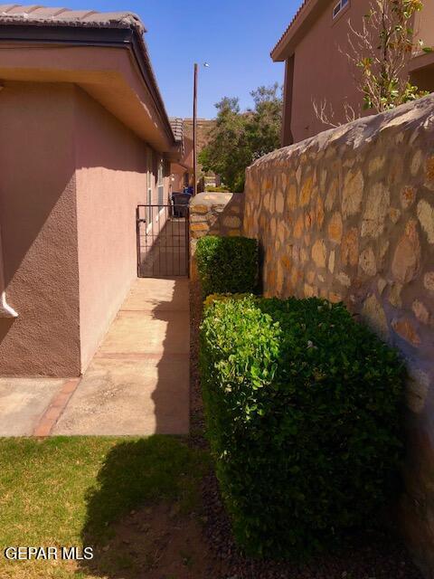 6392 Franklin Gate Dr, El Paso, TX 79912 - view of property exterior featuring a gate and stucco siding
