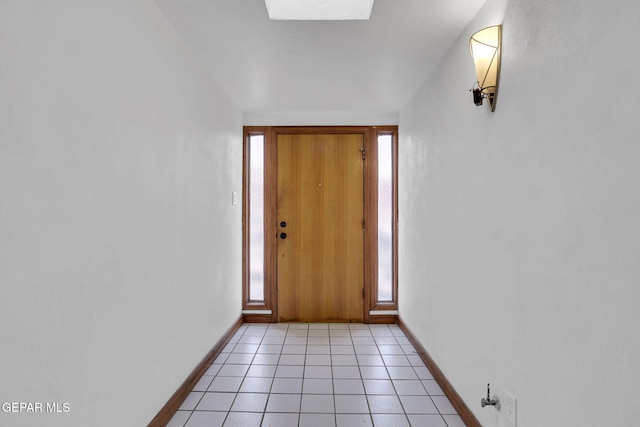 3310 Moonlight Ave, El Paso, TX 79904 - doorway to outside featuring a skylight and light tile patterned flooring