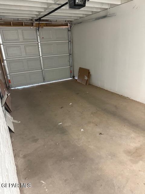 8141 Callison Rd, El Paso, TX 79907 - garage featuring a garage door opener