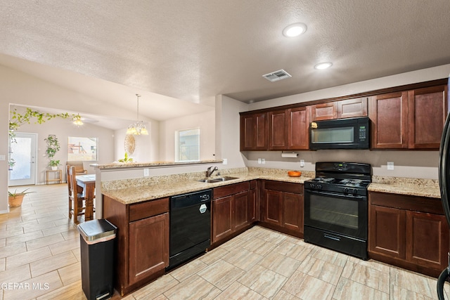 11625 Flor Clavel St, El Paso, TX 79927 - kitchen with black appliances, a peninsula, a textured ceiling, vaulted ceiling, and light stone countertops