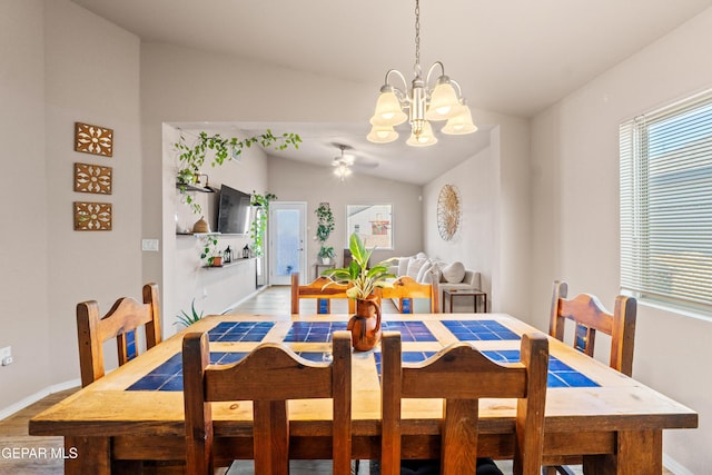 11625 Flor Clavel St, El Paso, TX 79927 - dining area featuring vaulted ceiling, a chandelier, light wood-style floors, and a ceiling fan