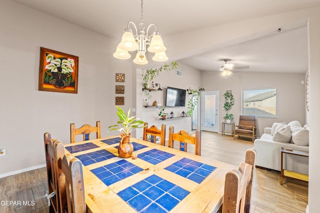 11625 Flor Clavel St, El Paso, TX 79927 - dining room featuring a chandelier, vaulted ceiling, wood finished floors, and a ceiling fan