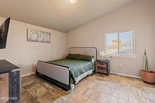 11625 Flor Clavel St, El Paso, TX 79927 - bedroom with lofted ceiling and baseboards
