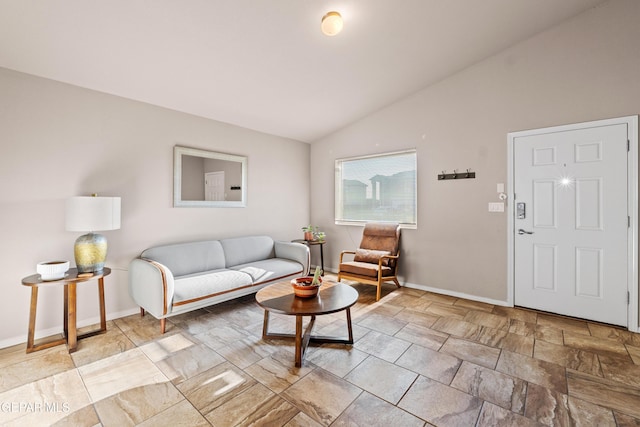 11625 Flor Clavel St, El Paso, TX 79927 - living area featuring lofted ceiling and light stone finish flooring