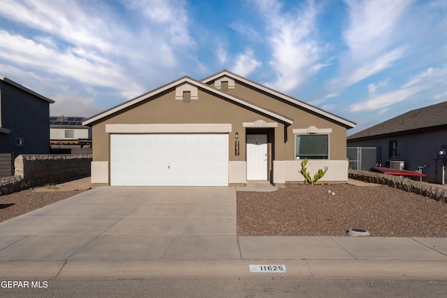11625 Flor Clavel St, El Paso, TX 79927 - ranch-style home featuring stucco siding, driveway, and a garage
