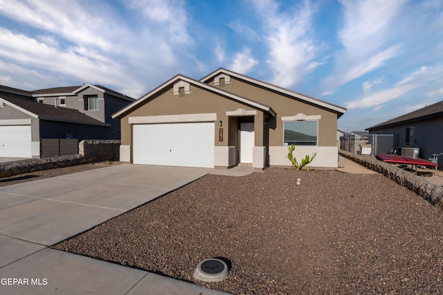 11625 Flor Clavel St, El Paso, TX 79927 - ranch-style home with concrete driveway, stucco siding, and an attached garage