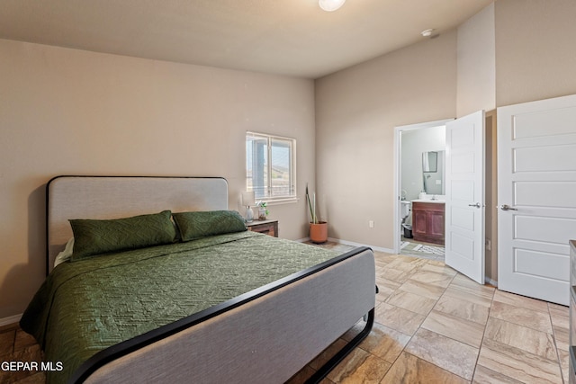 11625 Flor Clavel St, El Paso, TX 79927 - bedroom with baseboards and ensuite bathroom