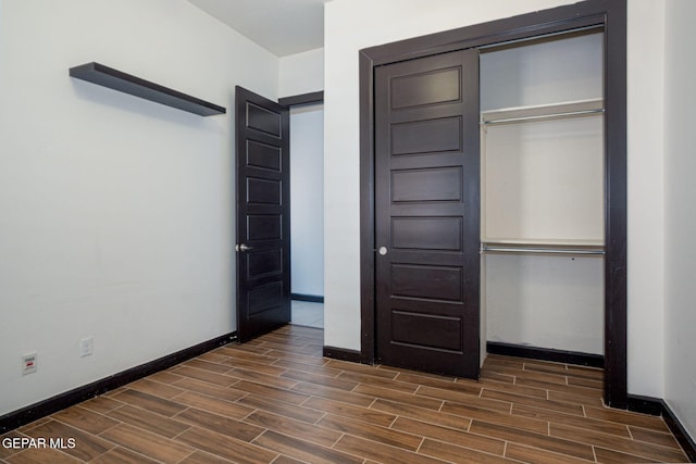6585 Hermoso Del Sol Dr, El Paso, TX 79911 - unfurnished bedroom featuring wood tiled floors and a closet