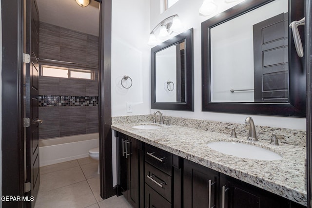 6585 Hermoso Del Sol Dr, El Paso, TX 79911 - bathroom with double vanity, tile patterned floors, and washtub / shower combination