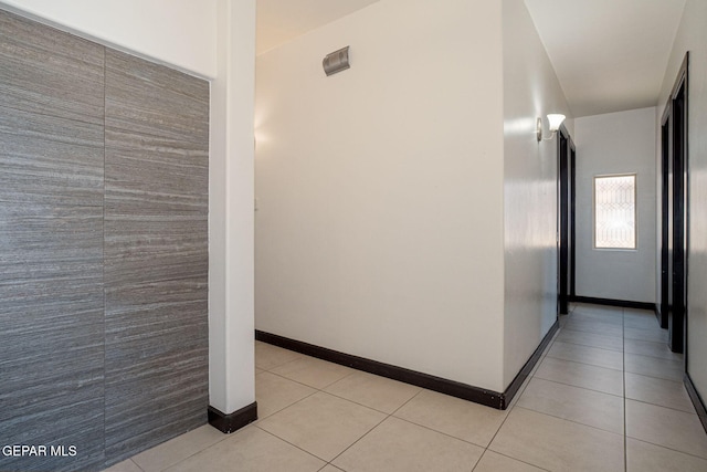 6585 Hermoso Del Sol Dr, El Paso, TX 79911 - hallway with light tile patterned floors and baseboards