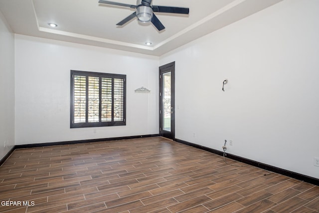 6585 Hermoso Del Sol Dr, El Paso, TX 79911 - empty room featuring wood finished floors, a tray ceiling, ceiling fan, and recessed lighting