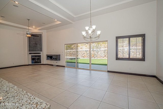 6585 Hermoso Del Sol Dr, El Paso, TX 79911 - unfurnished living room with a raised ceiling, a chandelier, tile patterned floors, a high ceiling, and a ceiling fan