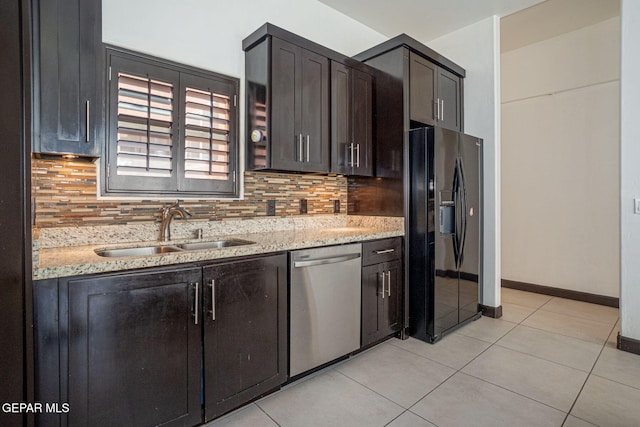 6585 Hermoso Del Sol Dr, El Paso, TX 79911 - kitchen featuring black fridge with ice dispenser, dishwasher, tasteful backsplash, and light stone countertops