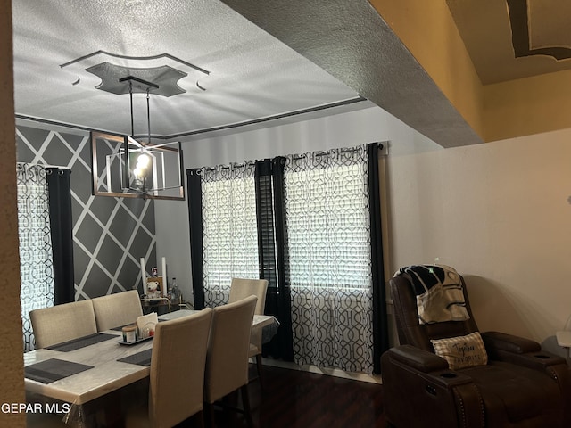 1012 Maple St, El Paso, TX 79903 - dining space with wood finished floors, a textured ceiling, and ceiling fan