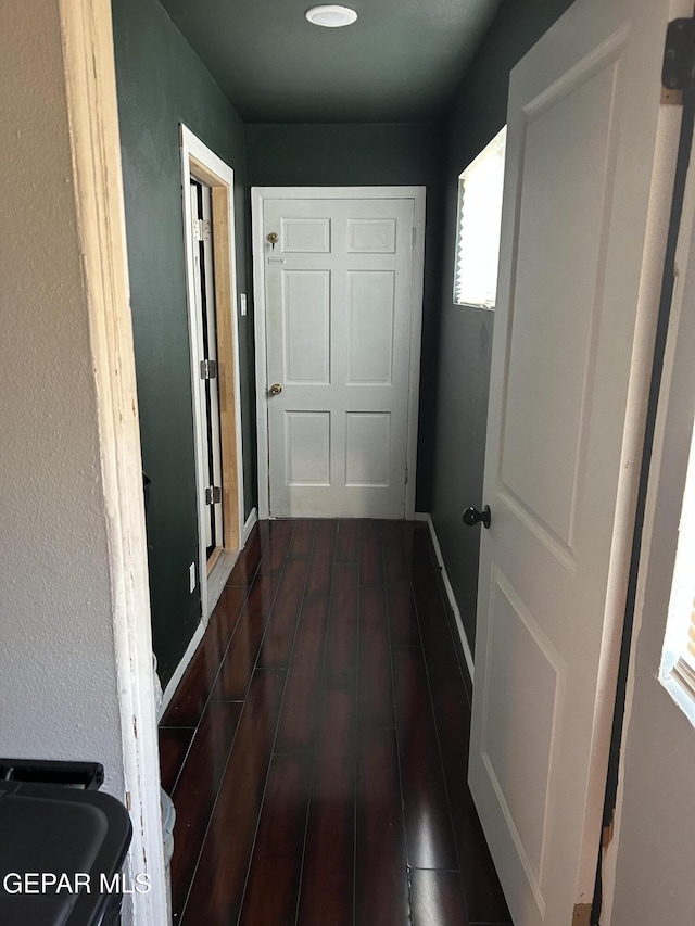 1012 Maple St, El Paso, TX 79903 - hall with dark wood-style floors and baseboards