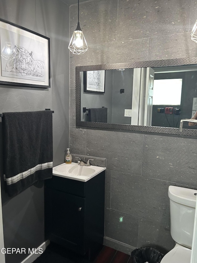 1012 Maple St, El Paso, TX 79903 - bathroom featuring vanity and wood finished floors