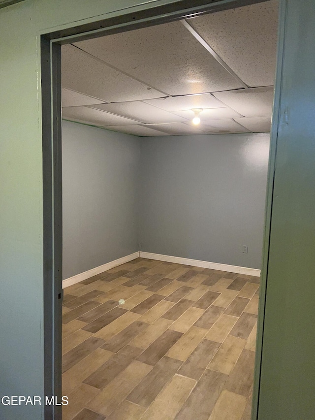 1012 Maple St, El Paso, TX 79903 - empty room featuring wood finished floors and a drop ceiling