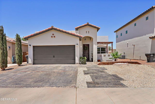 13459 Bradford St, Horizon City, TX 79928 - mediterranean / spanish home with a tiled roof, stucco siding, an attached garage, and driveway