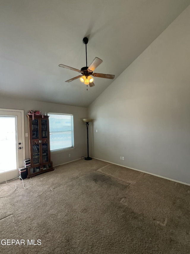 12000 Stansbury Dr, El Paso, TX 79928 - carpeted empty room featuring vaulted ceiling and ceiling fan